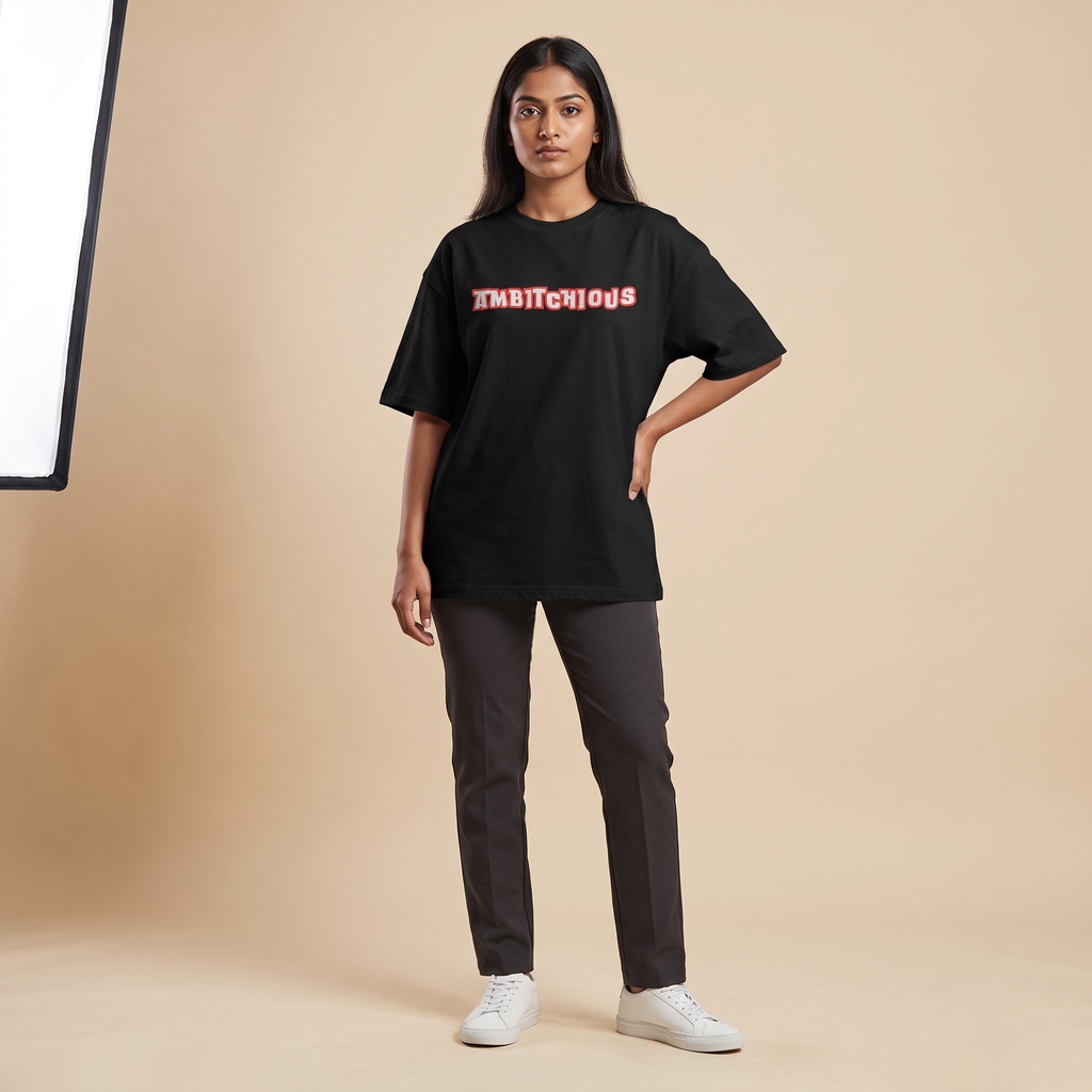 Female model wearing Ambitchious oversized t-shirt, front view showing chest print