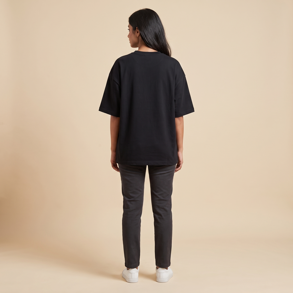 Female model wearing Ambitchious oversized t-shirt, back view