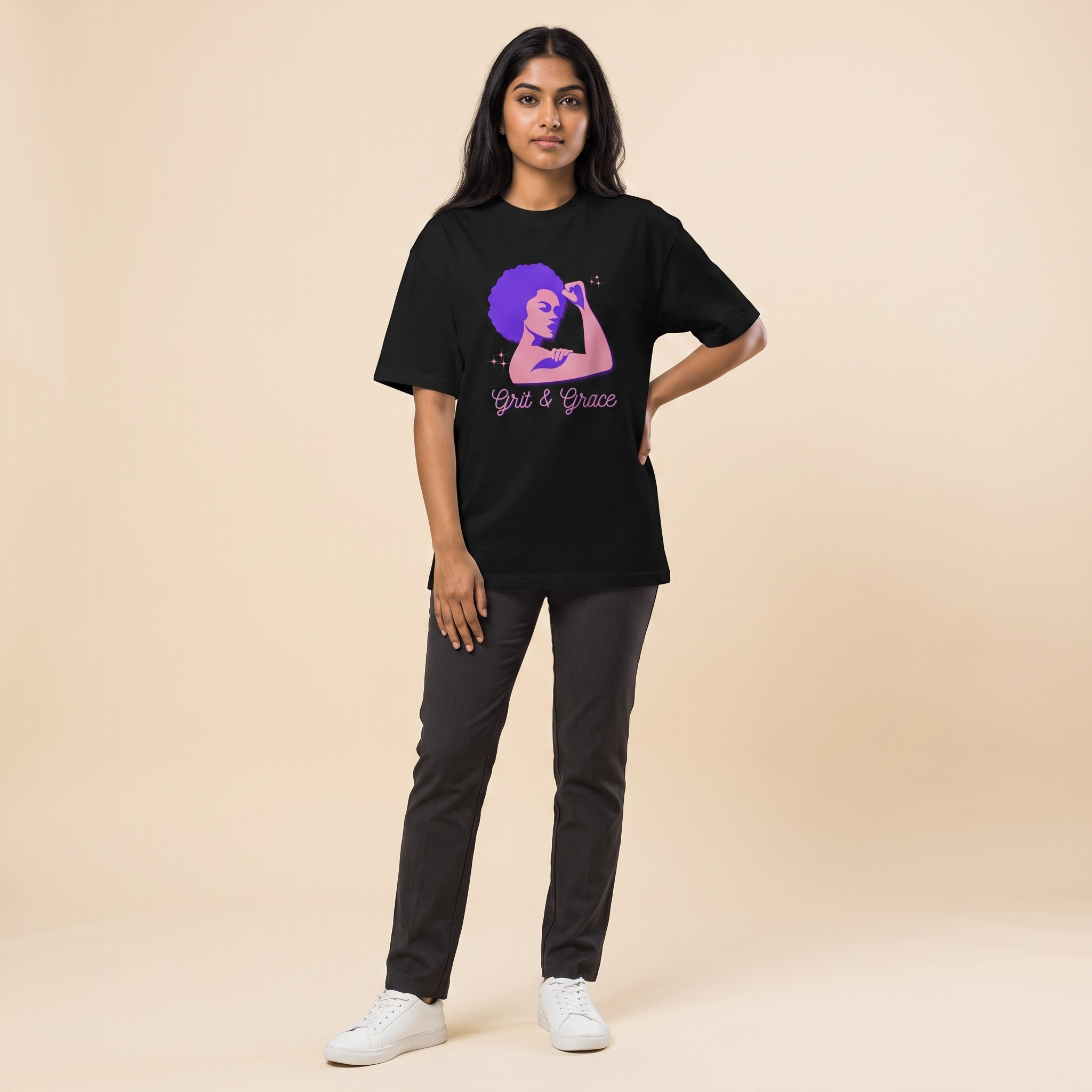 Female model wearing Grit and Grace oversized t-shirt, front view showing chest print