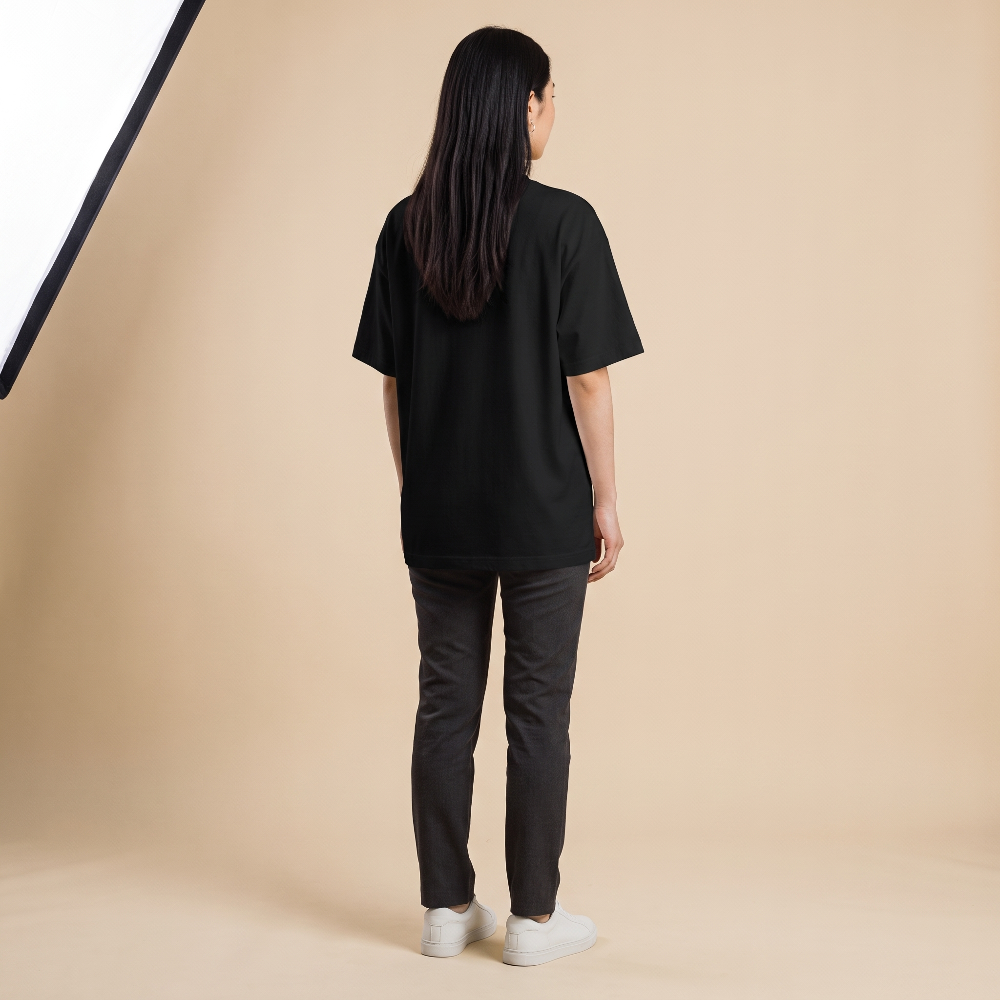 Female model wearing Grit and Grace oversized t-shirt, back view