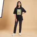 Female model wearing Trust The Process oversized t-shirt, front view showing chest print