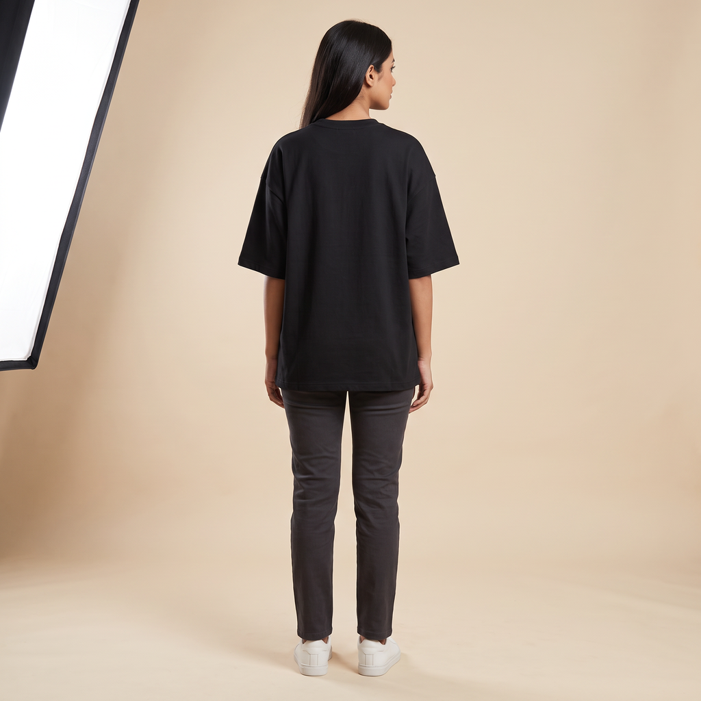 Female model wearing Trust The Process oversized t-shirt, back view