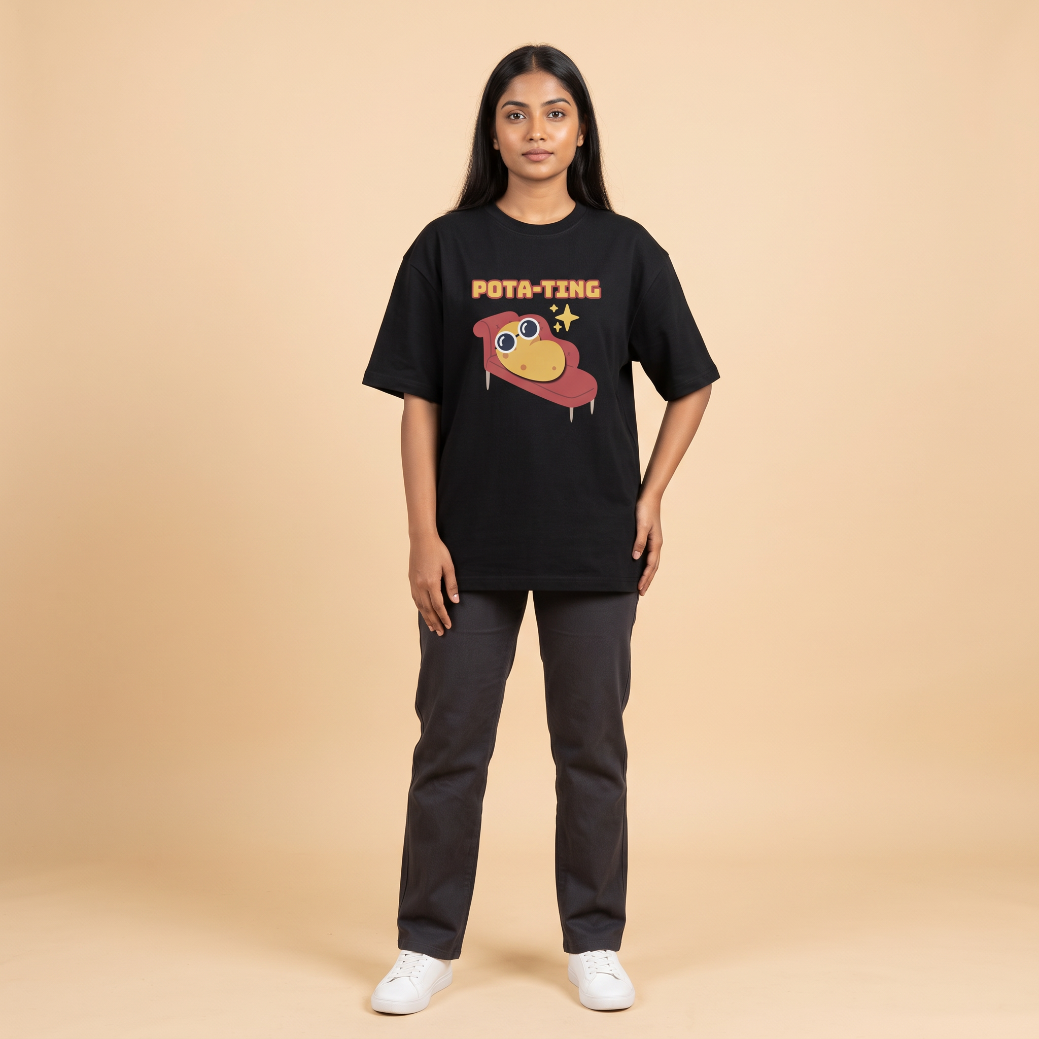 Female model wearing Pota-Ting oversized t-shirt, front view showing chest print