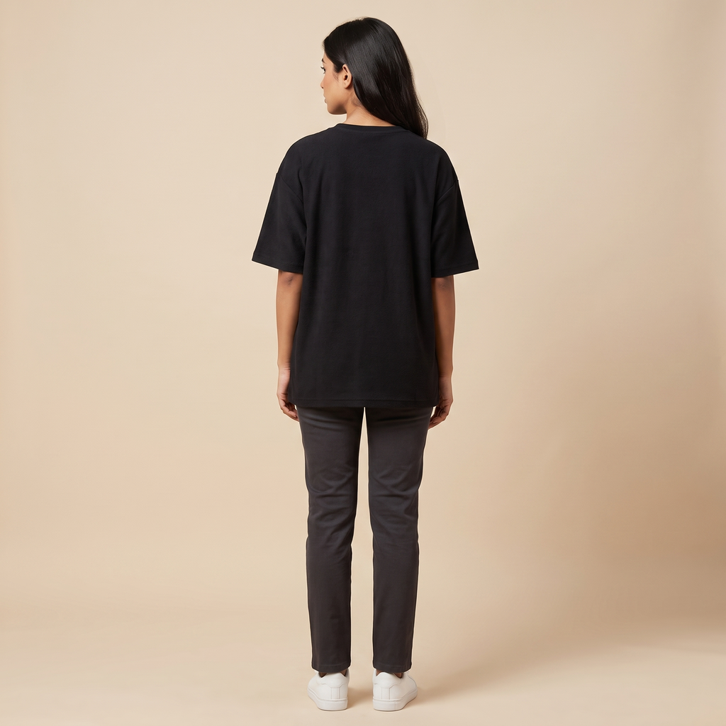Female model wearing Pota-Ting oversized t-shirt, back view