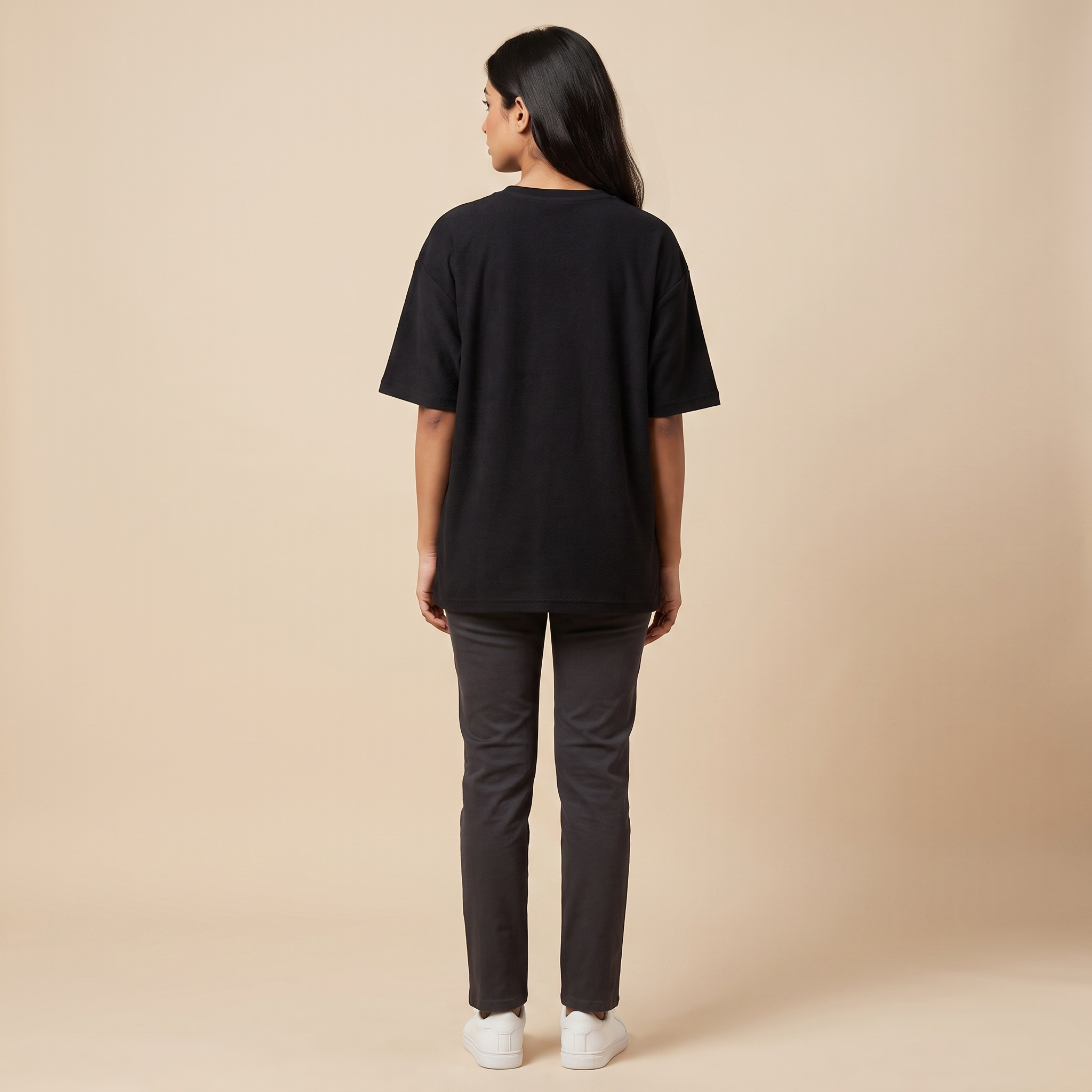 Female model wearing Pota-Ting oversized t-shirt, back view