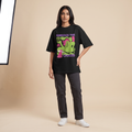 Female model wearing Embrace The Chaos oversized t-shirt, front view showing chest print