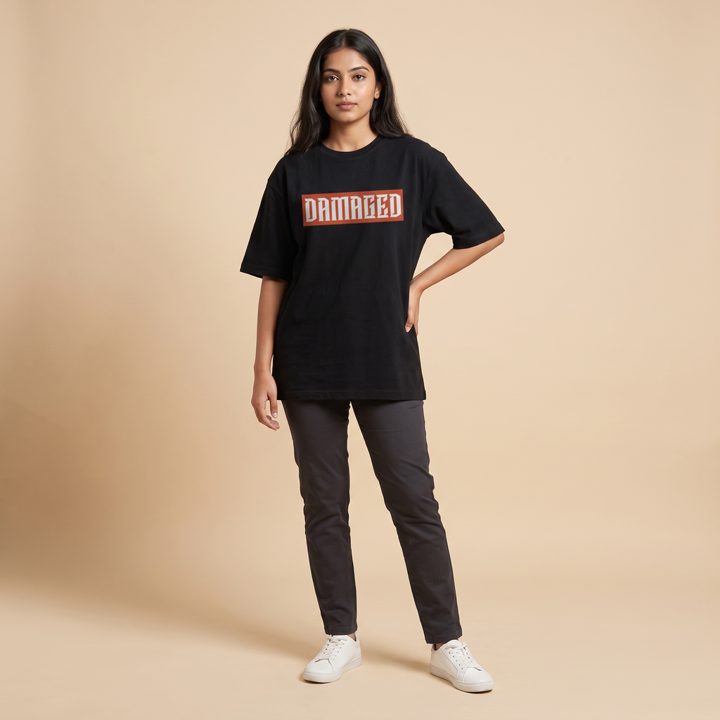 Female model wearing Damaged oversized t-shirt, front view showing chest print