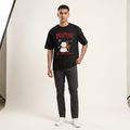 Model wearing December A Long Weekend oversized t-shirt, front view showing chest print