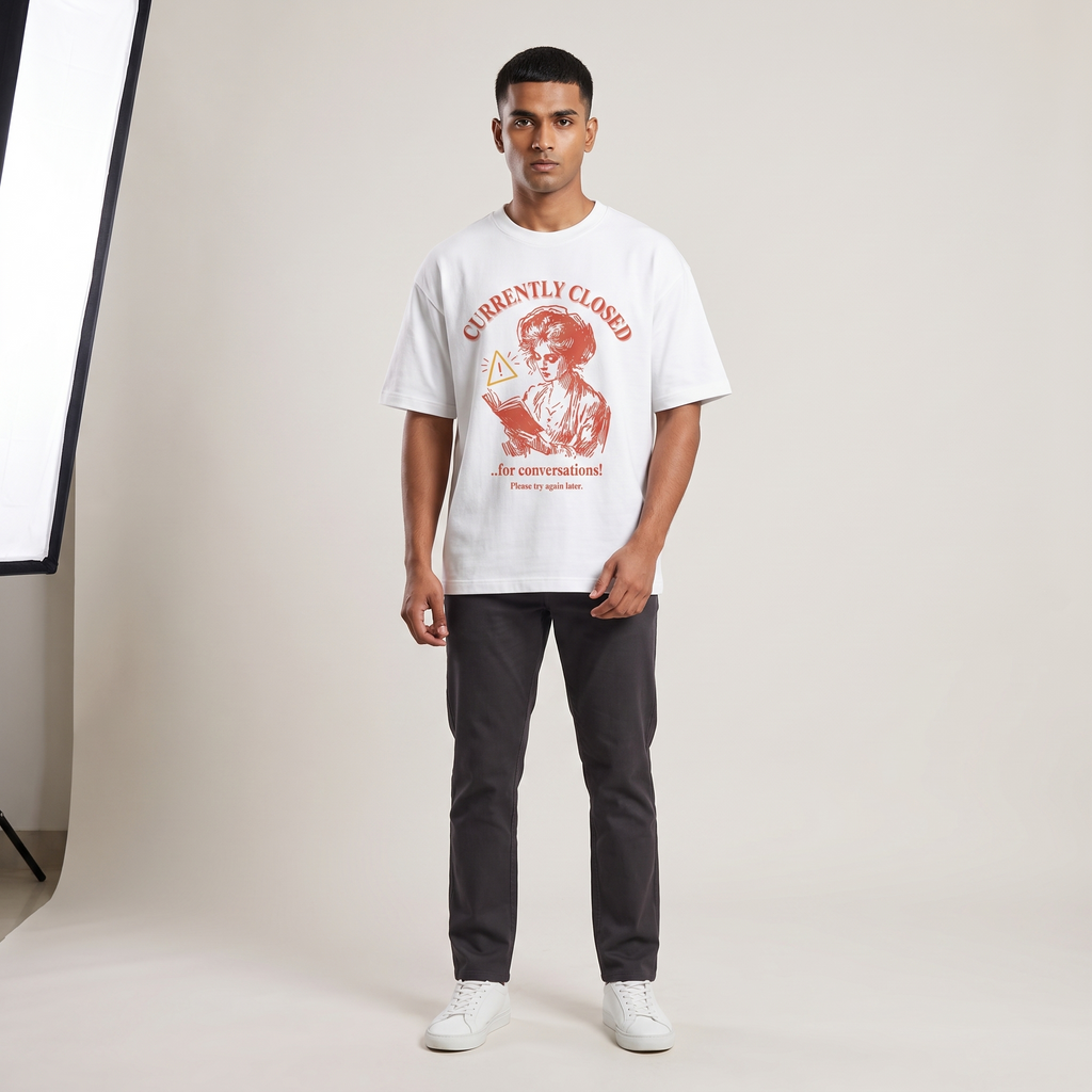 Model wearing Closed for Conversations oversized t-shirt, front view showing chest print
