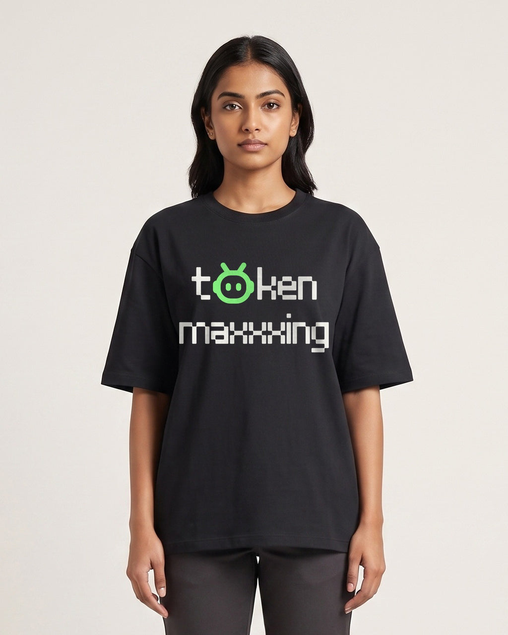 Token Maxxing - Dark - Black - Chapter26 premium oversized graphic t-shirt, worn by a female model